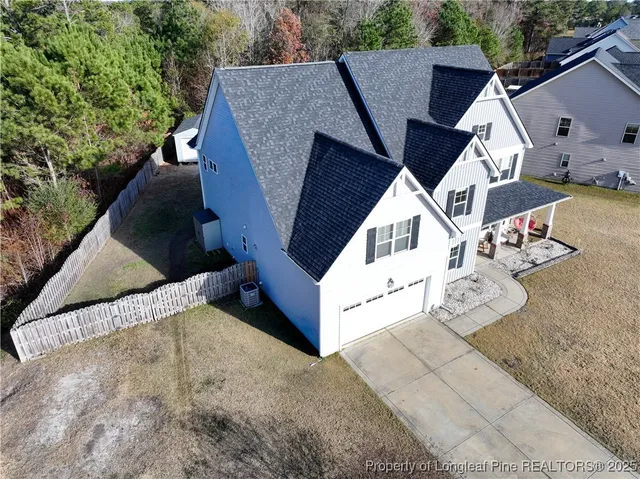 a view of a dining room with furniture wooden floor and chandelier