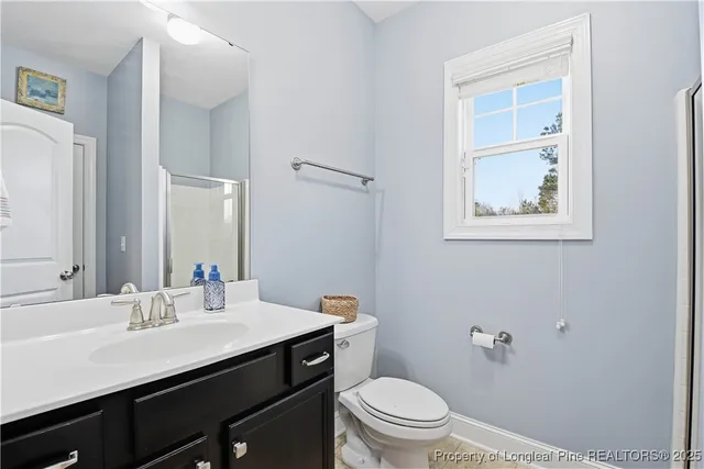 a bathroom with a sink double vanity and a mirror