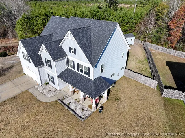 a house view with a backyard space