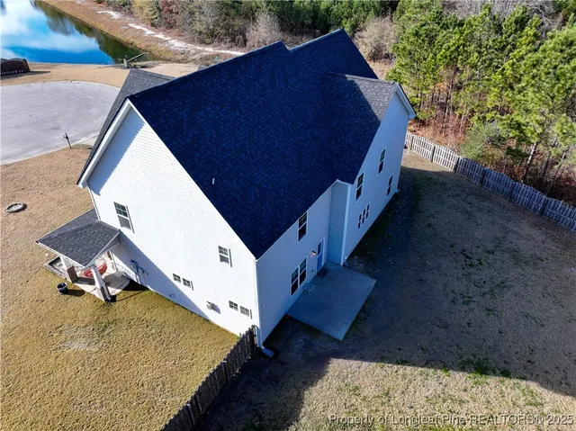 a view of a house with a sink and backyard