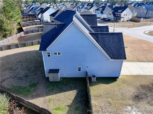 a view of a swimming pool with an outdoor seating and a garden