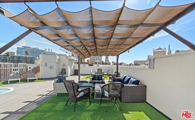 a view of a patio with couches and chairs
