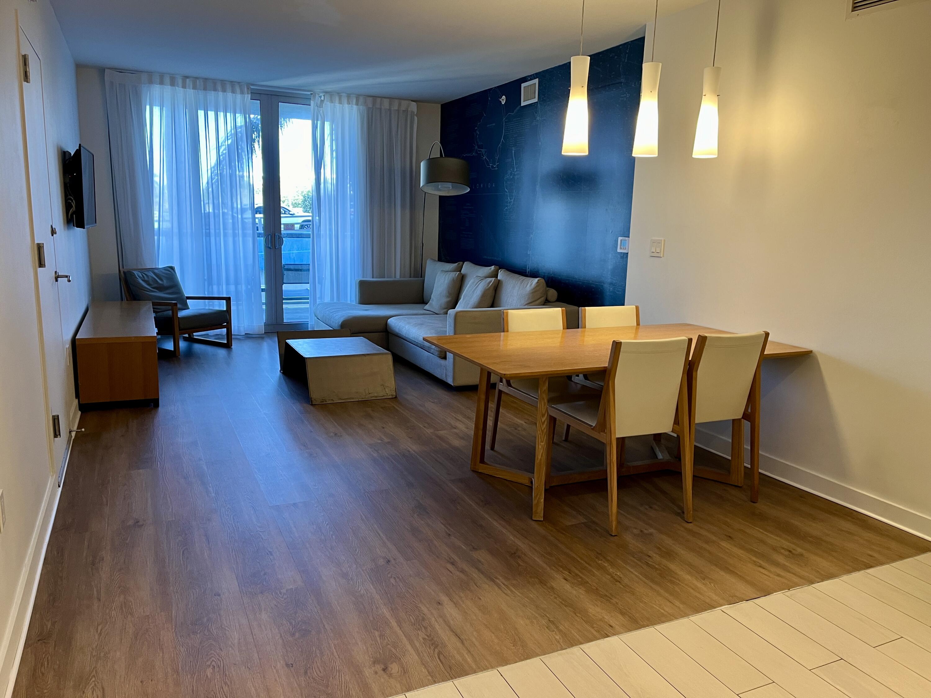 2602 East Hallandale Beach Boulevard, Unit R308 Hallandale Beach, FL 33009 - Photo 2 of 74 a living room with furniture and wooden floor