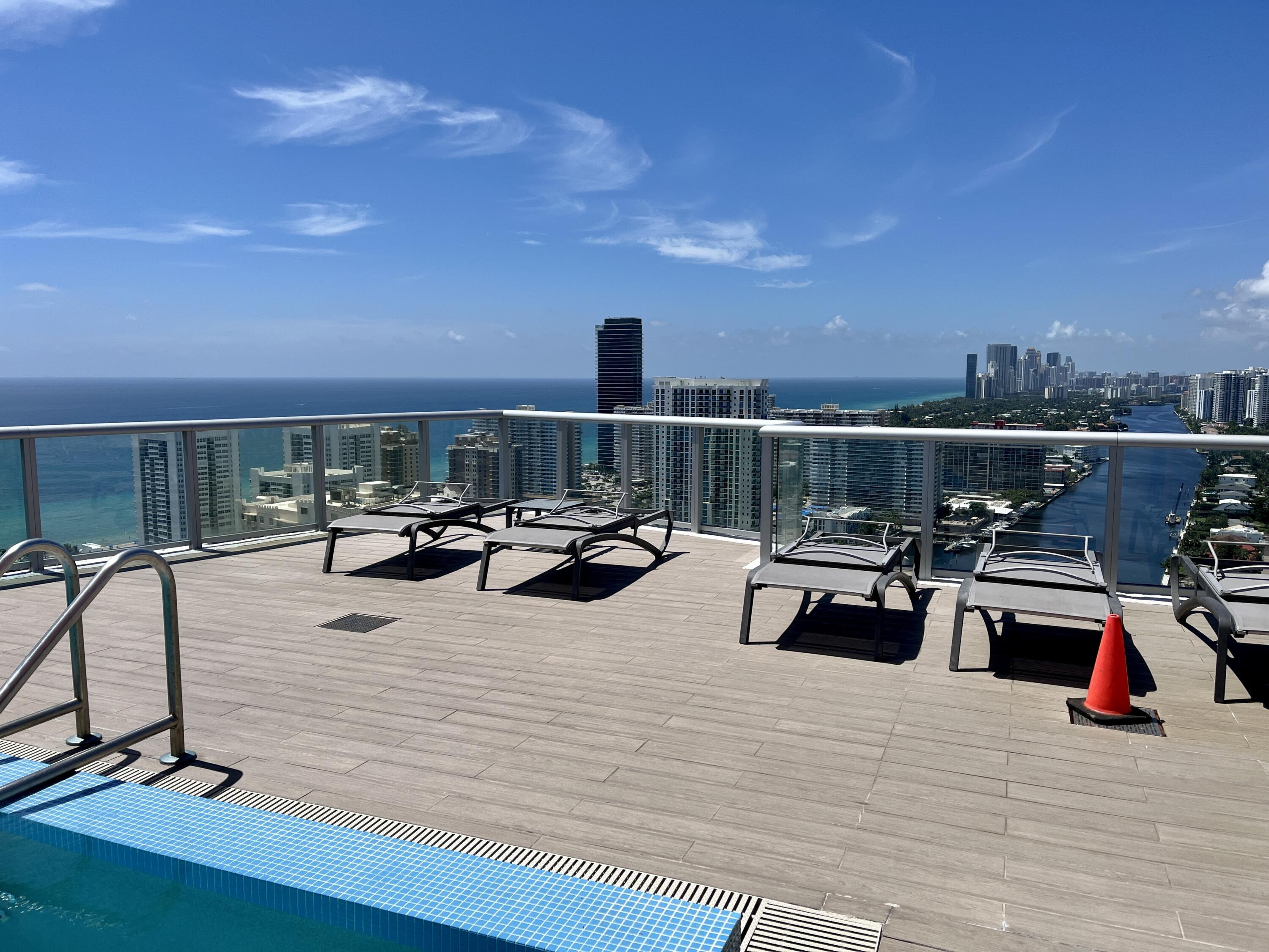 2602 East Hallandale Beach Boulevard, Unit R308 Hallandale Beach, FL 33009 - Photo 36 of 74 a view of a terrace with furniture