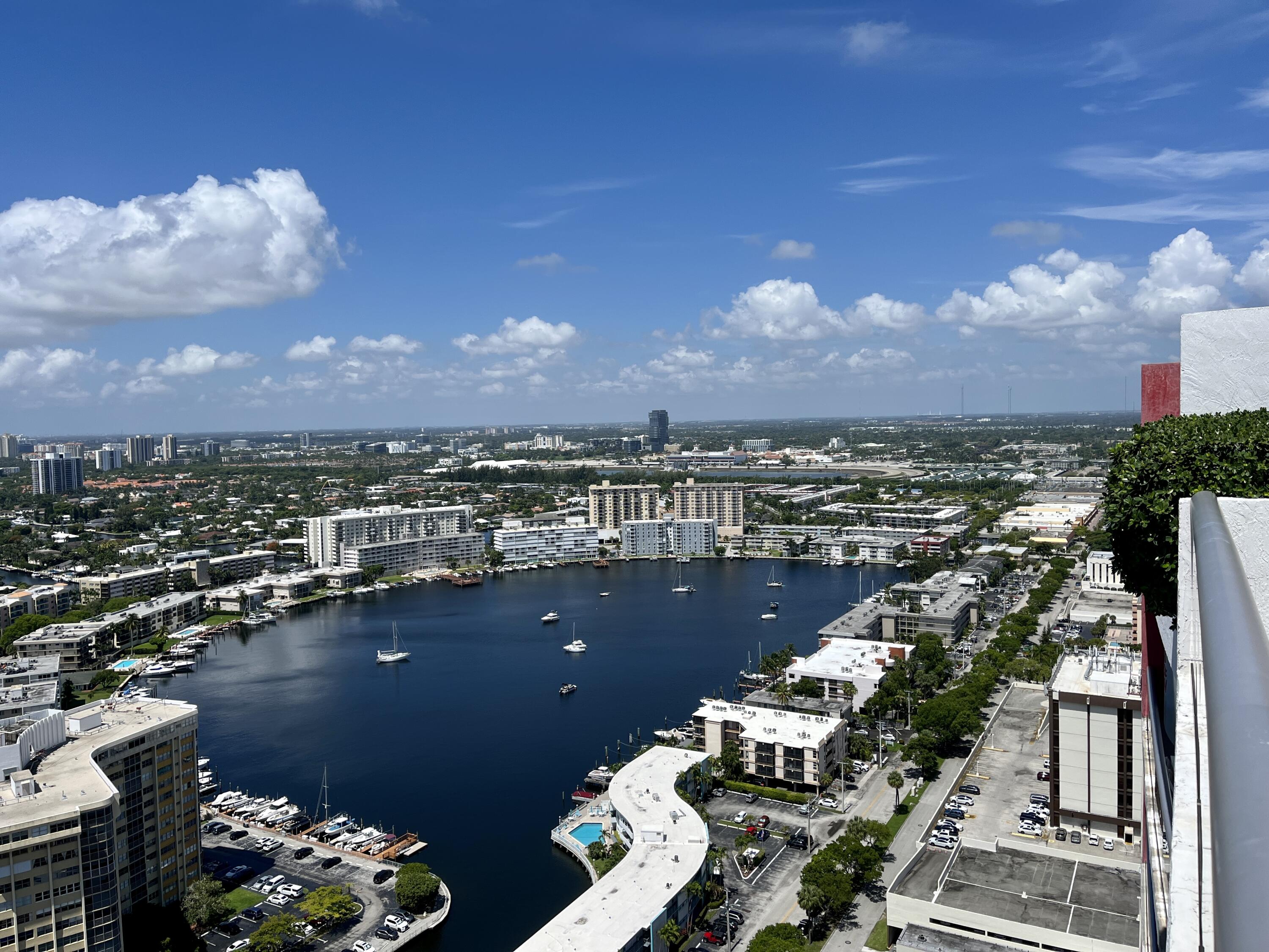 2602 East Hallandale Beach Boulevard, Unit R308 Hallandale Beach, FL 33009 - Photo 38 of 74 a view of a balcony with chairs