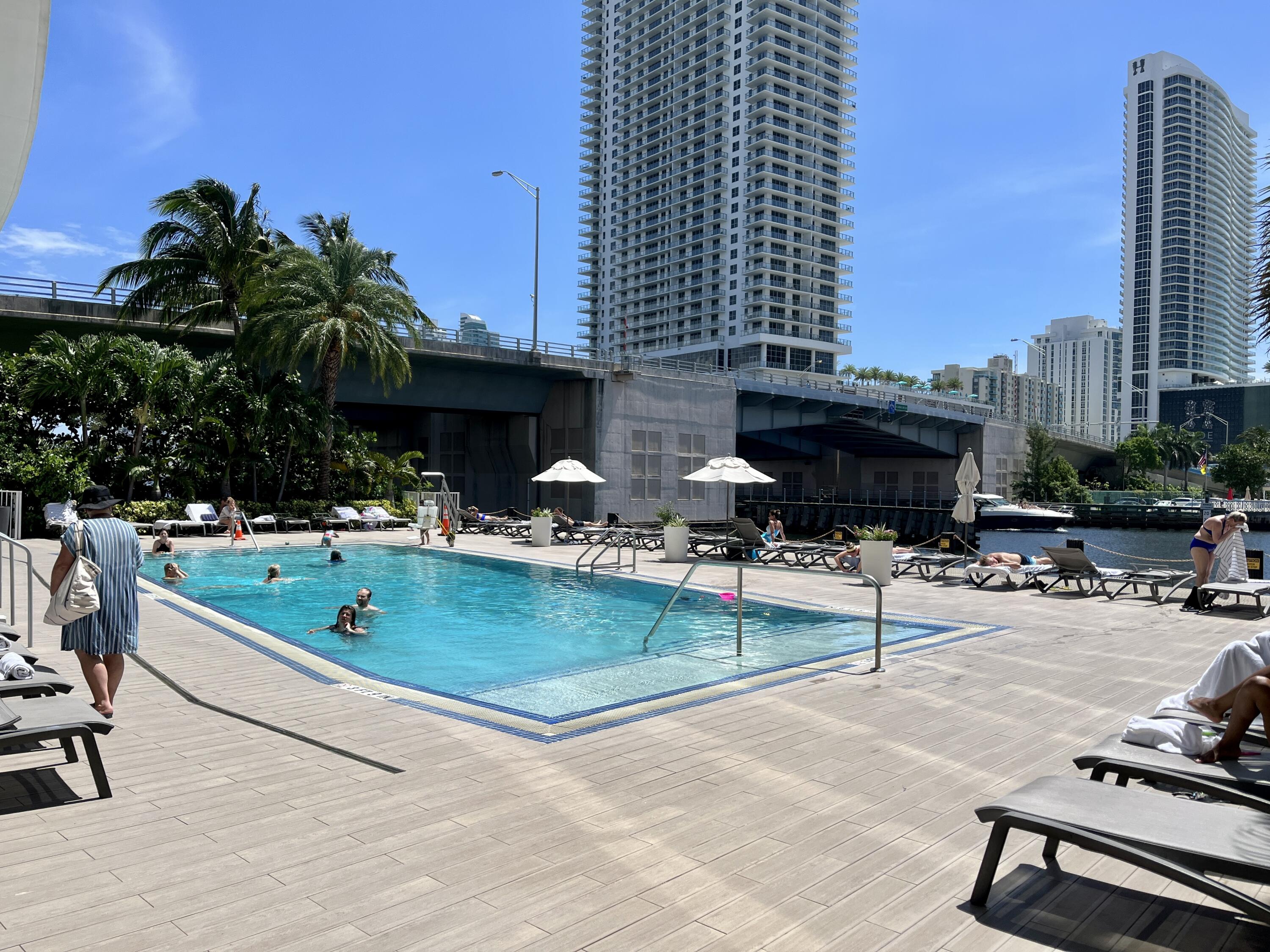 2602 East Hallandale Beach Boulevard, Unit R308 Hallandale Beach, FL 33009 - Photo 48 of 74 a view of swimming pool with outdoor seating and a terrace