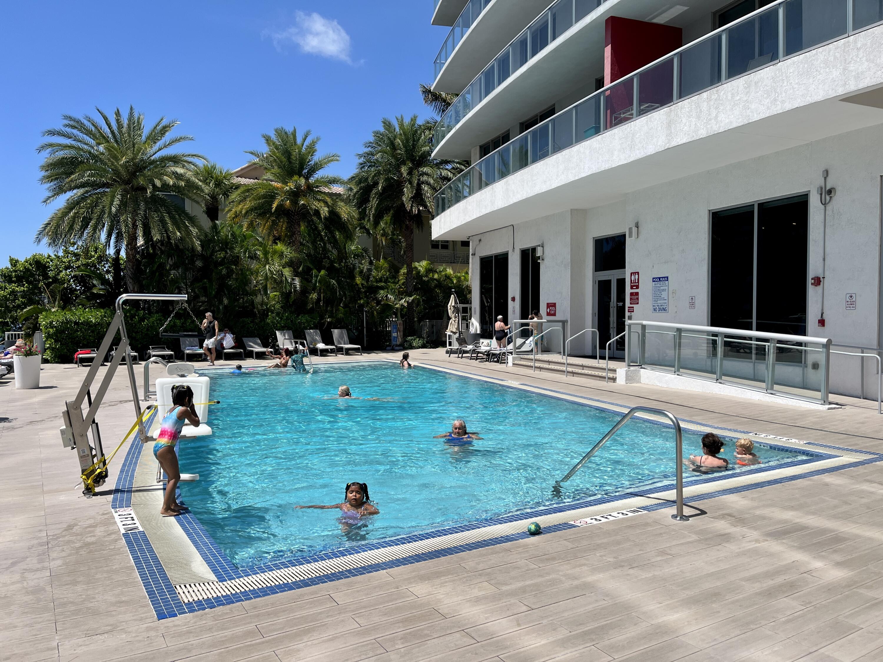 2602 East Hallandale Beach Boulevard, Unit R308 Hallandale Beach, FL 33009 - Photo 50 of 74 a view of a backyard with a patio and swimming pool