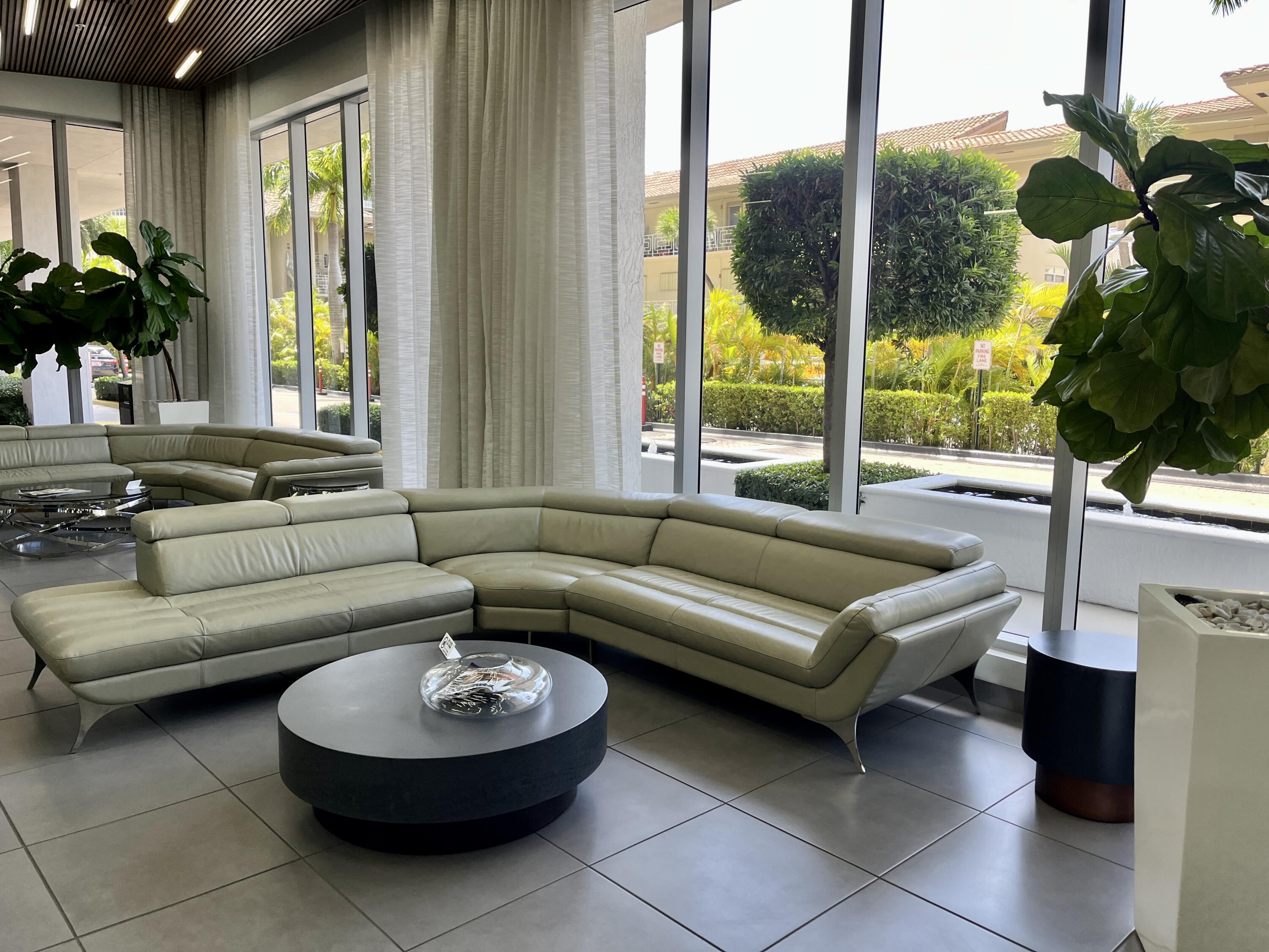 2602 East Hallandale Beach Boulevard, Unit R308 Hallandale Beach, FL 33009 - Photo 57 of 74 a living room with furniture and a large window