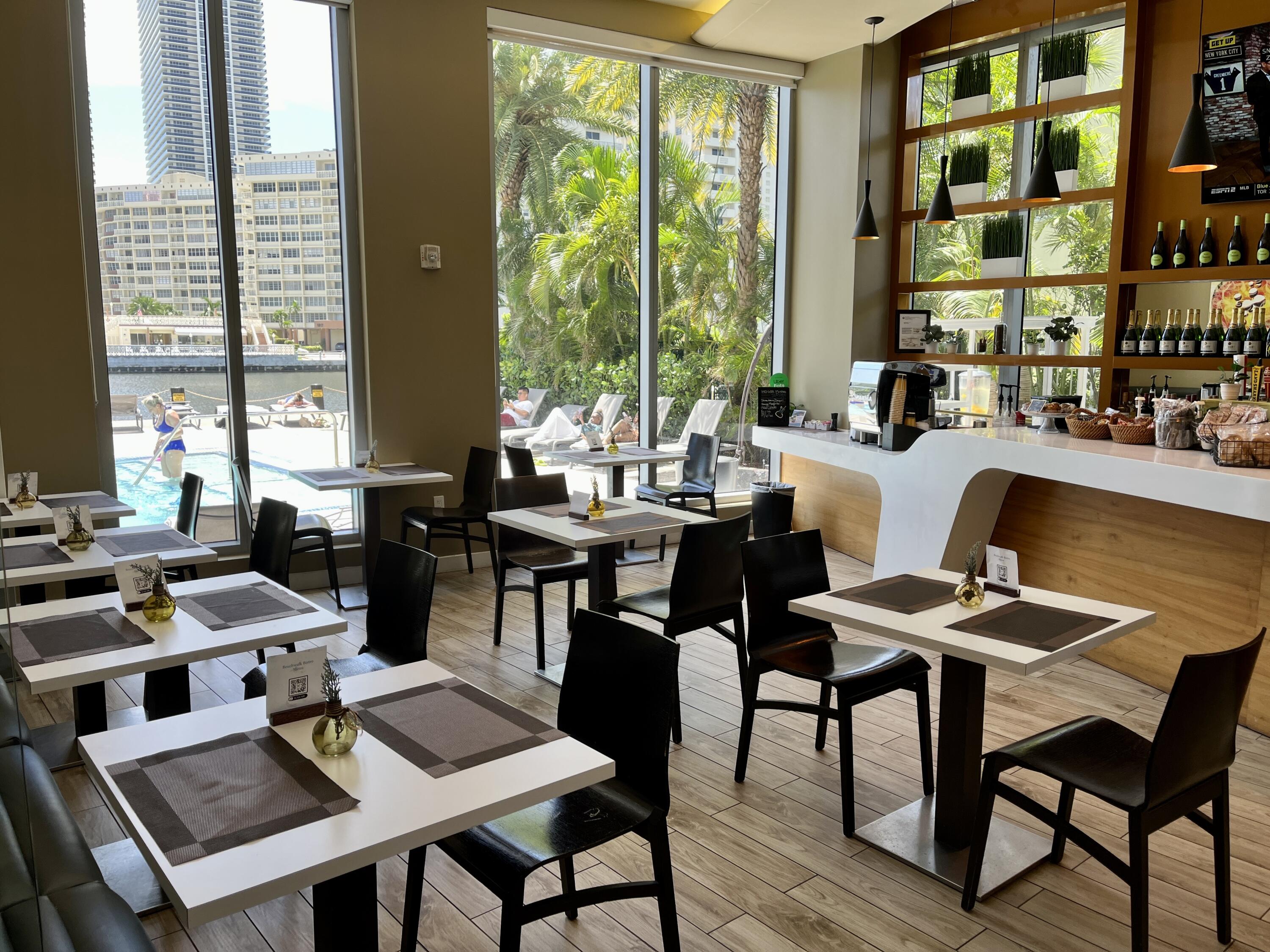 2602 East Hallandale Beach Boulevard, Unit R308 Hallandale Beach, FL 33009 - Photo 59 of 74 a living room with furniture and large windows