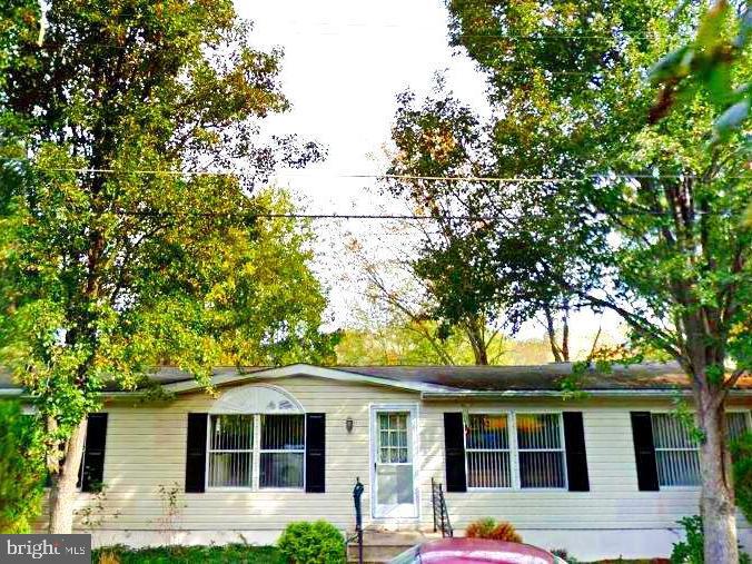 front view of a house with a tree