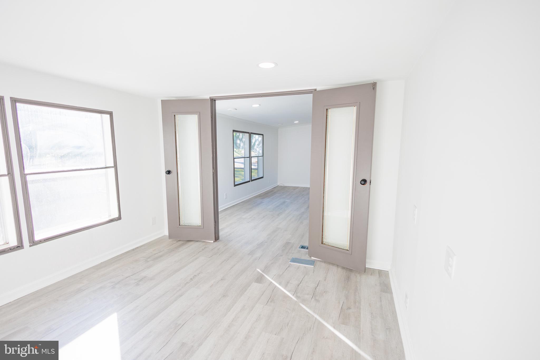 85 Hickory Avenue Mantua, NJ 08051 - Photo 11 of 28 an empty room with a bathroom and mirror