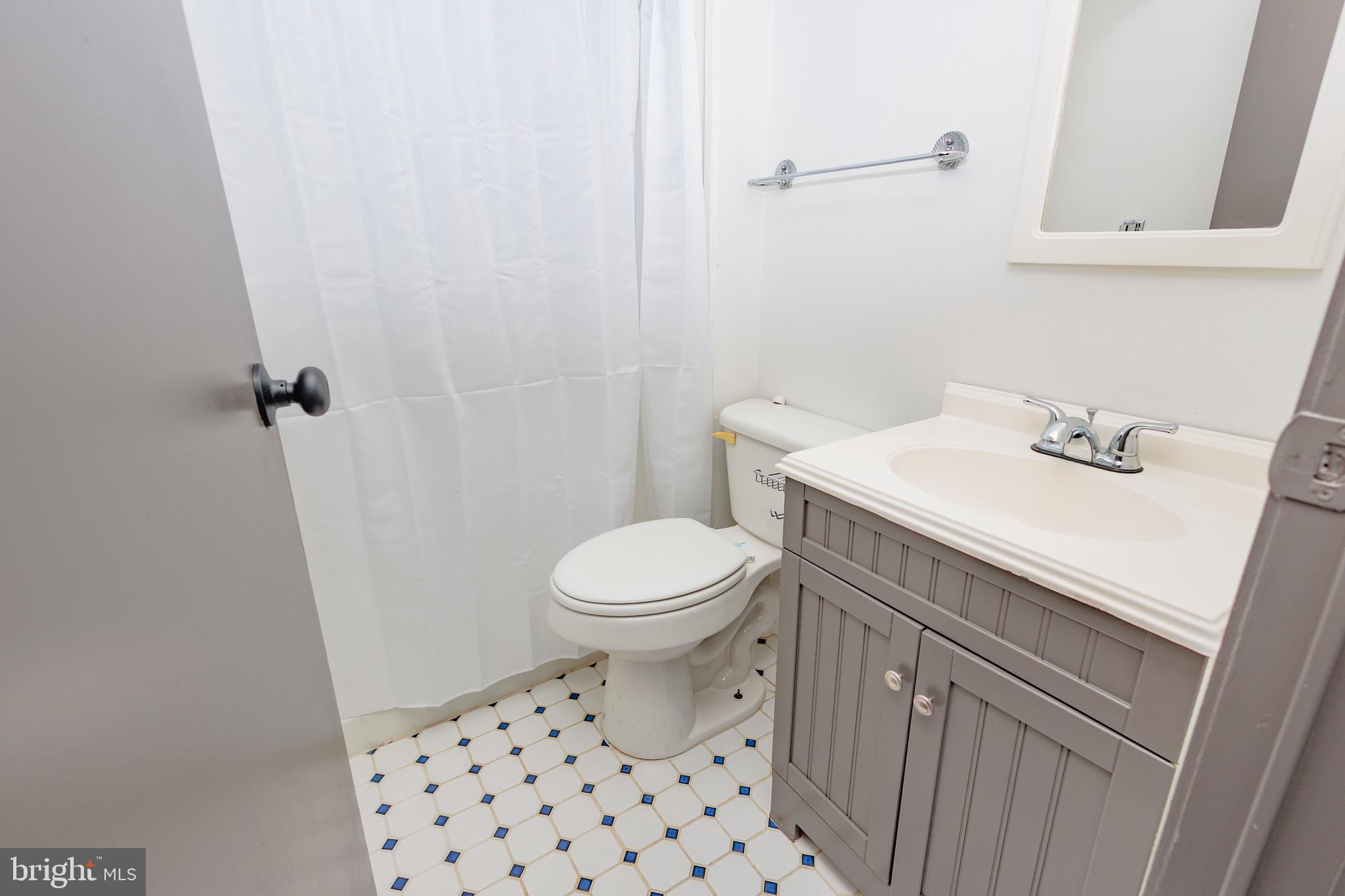 85 Hickory Avenue Mantua, NJ 08051 - Photo 16 of 28 a bathroom with a sink a toilet and a mirror