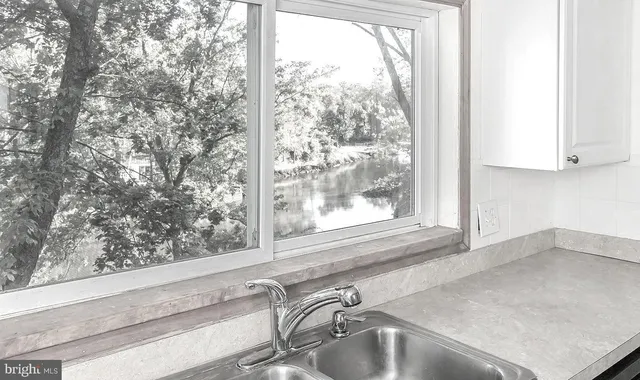 a view of a sink and a window