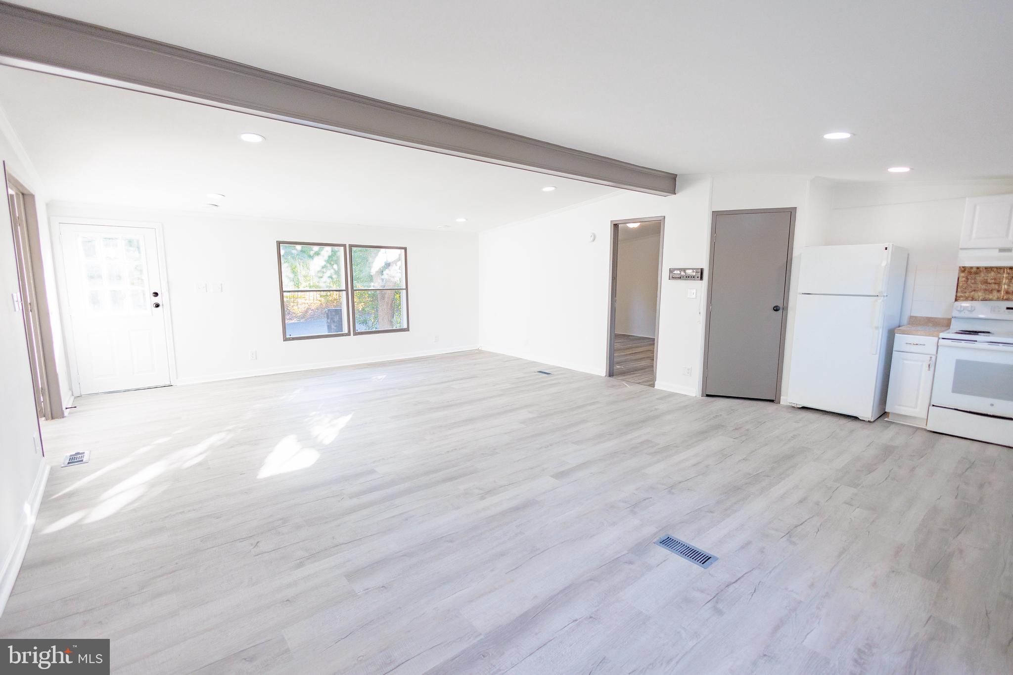 85 Hickory Avenue Mantua, NJ 08051 - Photo 6 of 28 a view of empty room with wooden floor and window