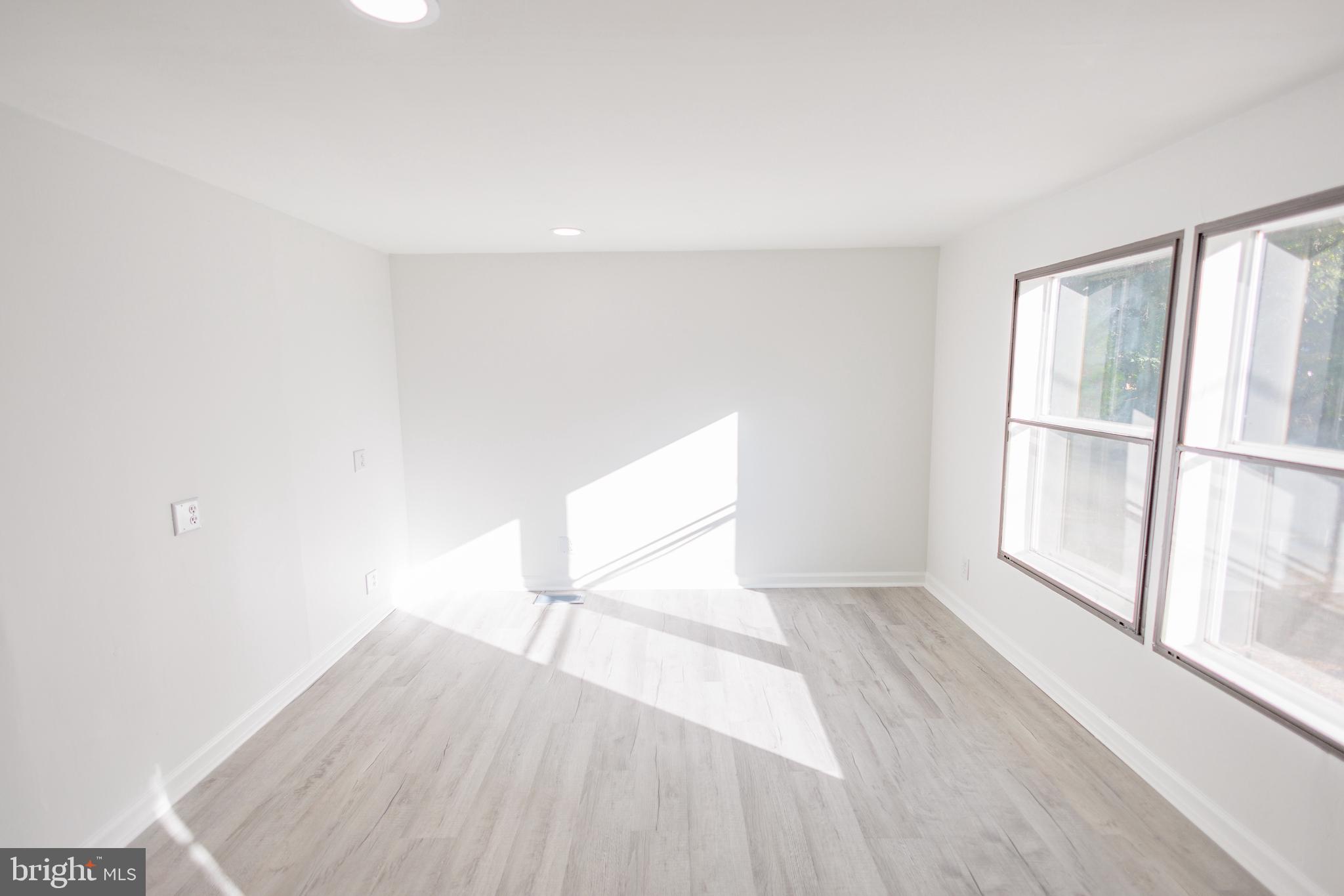 85 Hickory Avenue Mantua, NJ 08051 - Photo 9 of 28 a view of empty room with wooden floor and fan