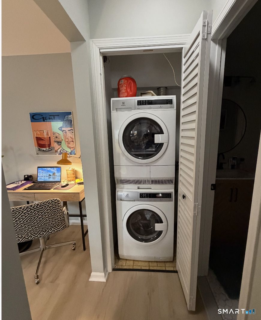 125 Warner Hill Road, Unit 20 Stratford, CT 06614 - Photo 12 of 17 a workspace with a washer and dryer