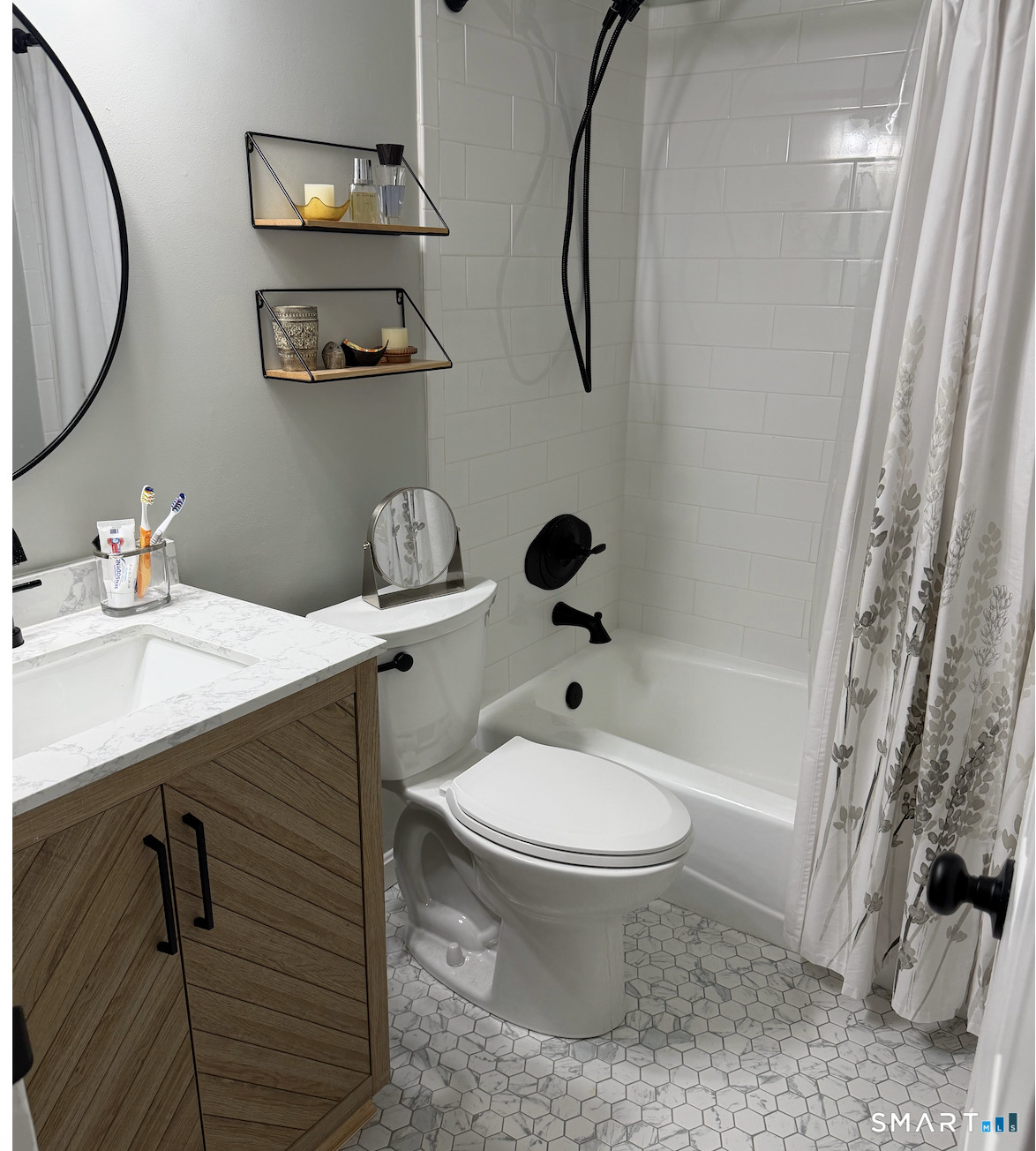 125 Warner Hill Road, Unit 20 Stratford, CT 06614 - Photo 14 of 17 a bathroom with a sink toilet and shower