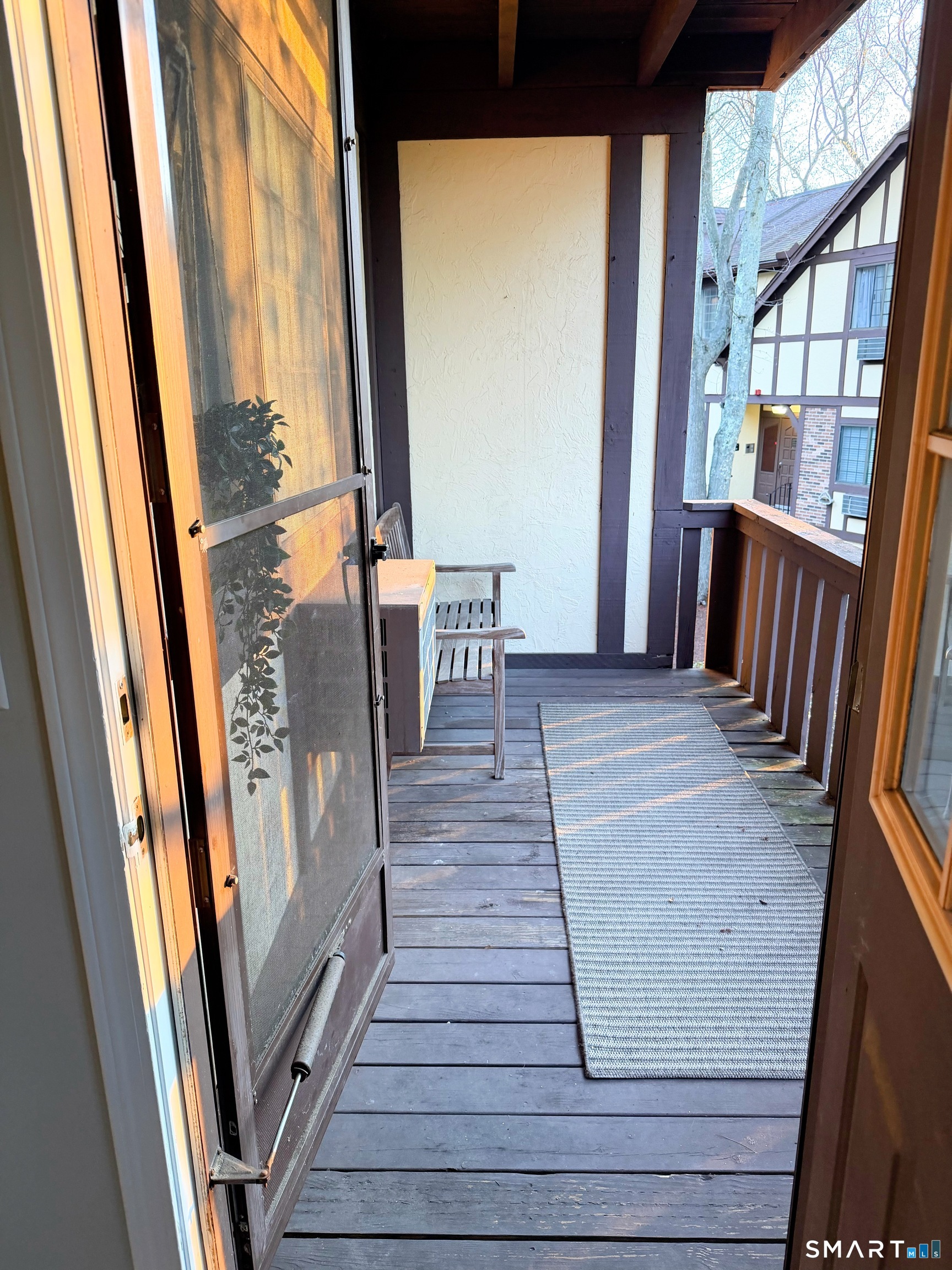 125 Warner Hill Road, Unit 20 Stratford, CT 06614 - Photo 16 of 17 a view of a hallway with wooden floor and stairs