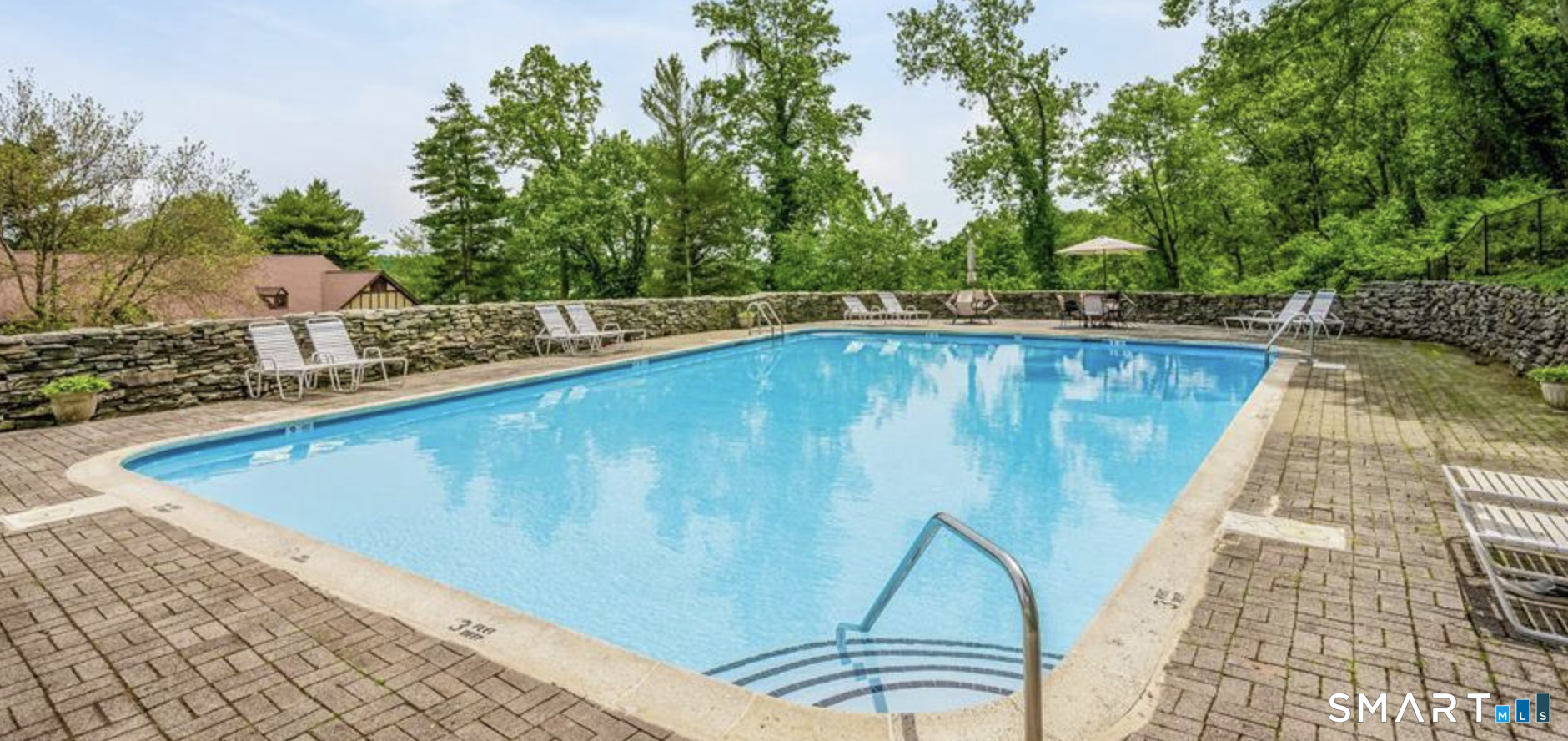 125 Warner Hill Road, Unit 20 Stratford, CT 06614 - Photo 17 of 17 a view of a swimming pool with a patio