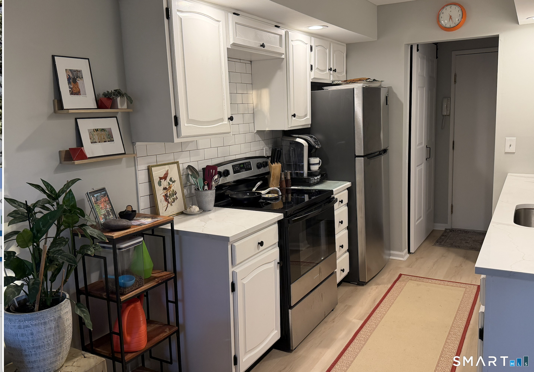 125 Warner Hill Road, Unit 20 Stratford, CT 06614 - Photo 10 of 17 a kitchen with stainless steel appliances a refrigerator sink and stove