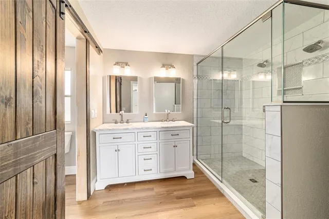 a view of a house with a swimming pool and sitting area
