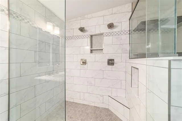 a view of a patio with table and chairs with wooden floor and fence