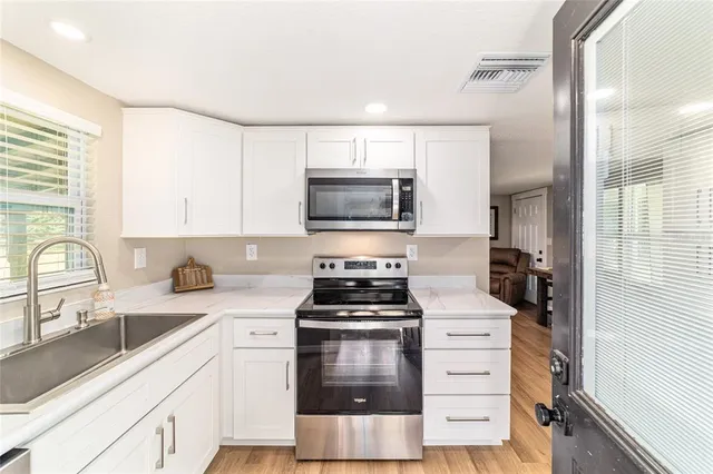 a view of a swimming pool with a patio