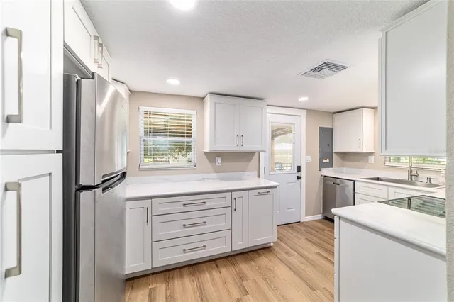 a view of a house with yard and sitting area