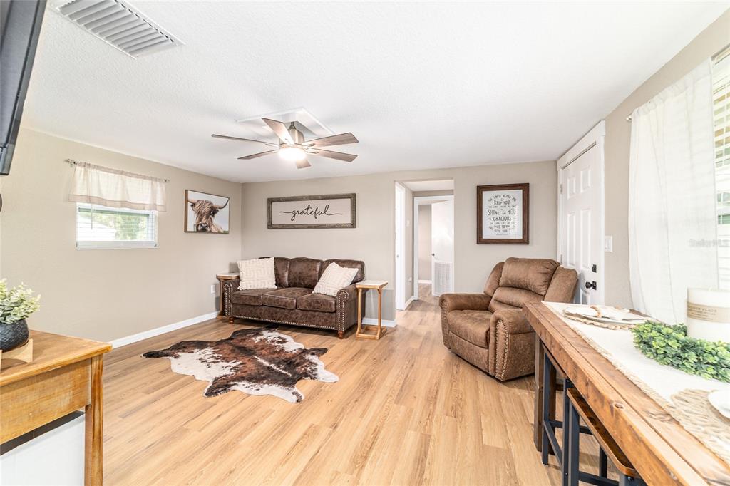 6155 Southeast Stetson Road Belleview, FL 34420 - Photo 44 of 68 a living room with furniture and a large window