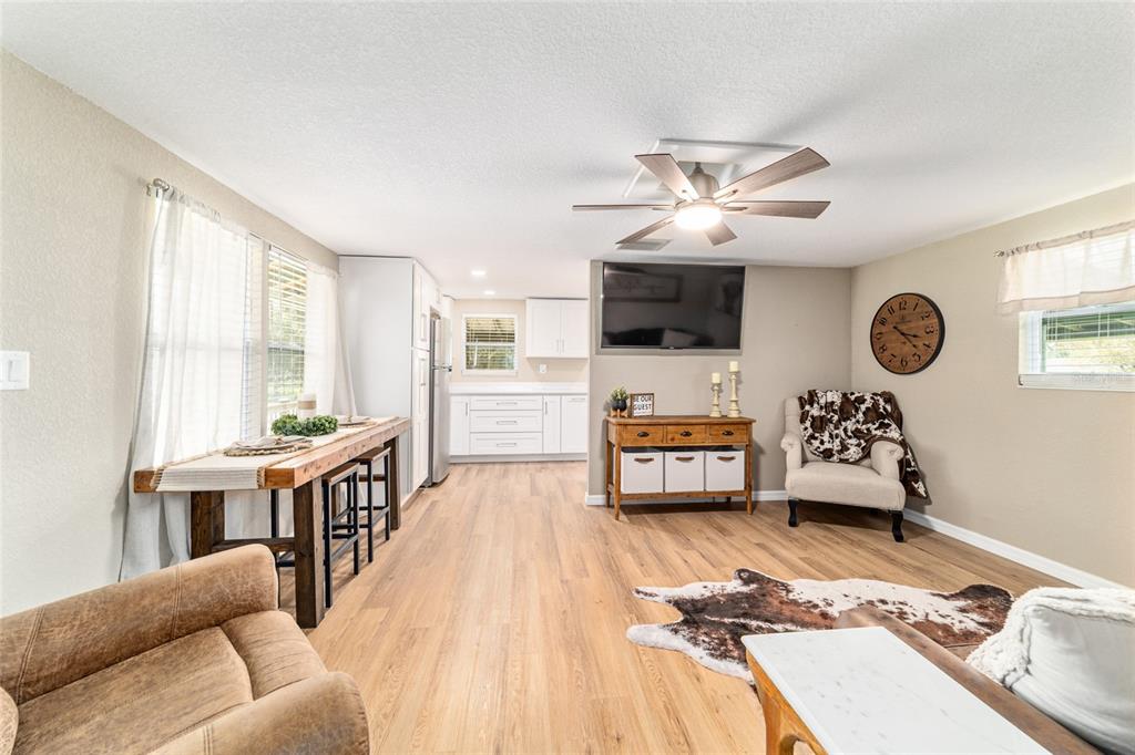 6155 Southeast Stetson Road Belleview, FL 34420 - Photo 46 of 68 a living room with furniture and a flat screen tv