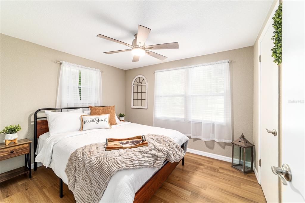 6155 Southeast Stetson Road Belleview, FL 34420 - Photo 48 of 68 a bedroom with a large bed and a window