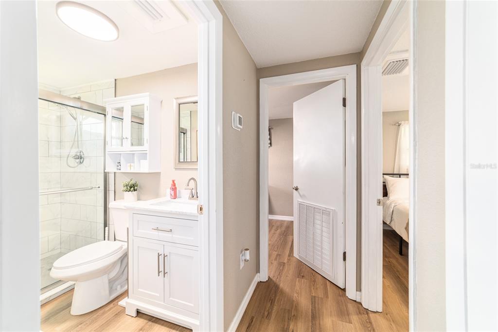 6155 Southeast Stetson Road Belleview, FL 34420 - Photo 50 of 68 a bathroom with a toilet sink a shower and a mirror