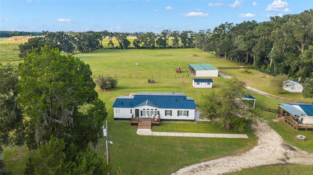 6155 Southeast Stetson Road Belleview, FL 34420 - Photo 63 of 68 an aerial view of a house with a garden