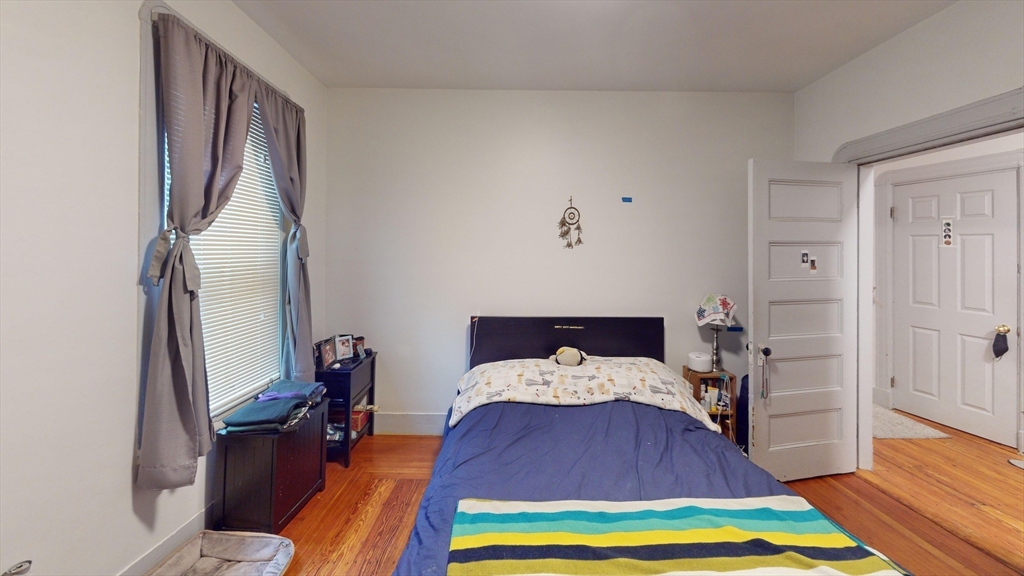 22 Boynton Street Boston, MA 02130 - Photo 14 of 34 a living room with furniture and a wooden floor