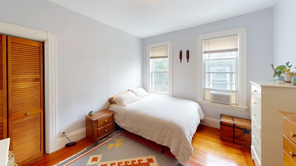 22 Boynton Street Boston, MA 02130 - Photo 17 of 34 a bedroom with a bed and a window