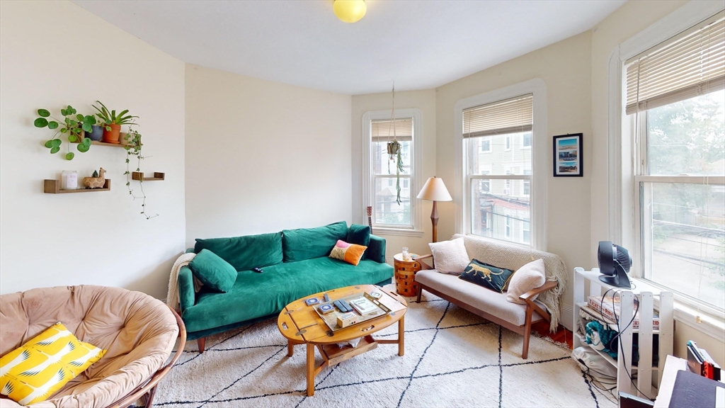 22 Boynton Street Boston, MA 02130 - Photo 2 of 34 a living room with furniture and a window