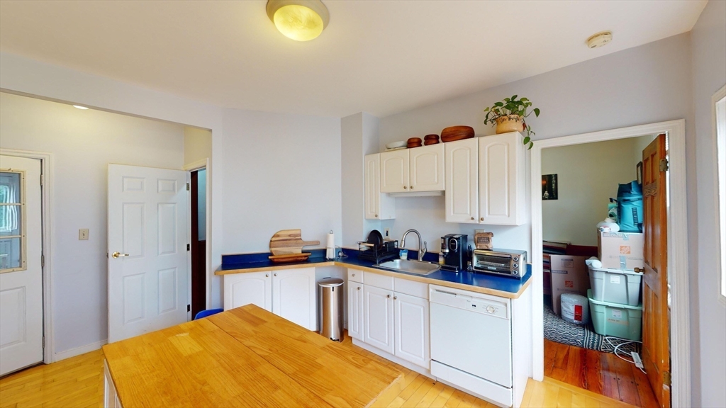 22 Boynton Street Boston, MA 02130 - Photo 21 of 34 a kitchen with a sink and cabinets