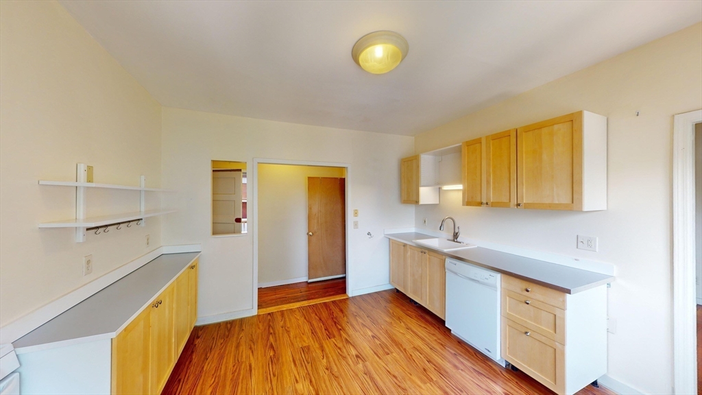 22 Boynton Street Boston, MA 02130 - Photo 25 of 34 a kitchen with a sink and wooden floor