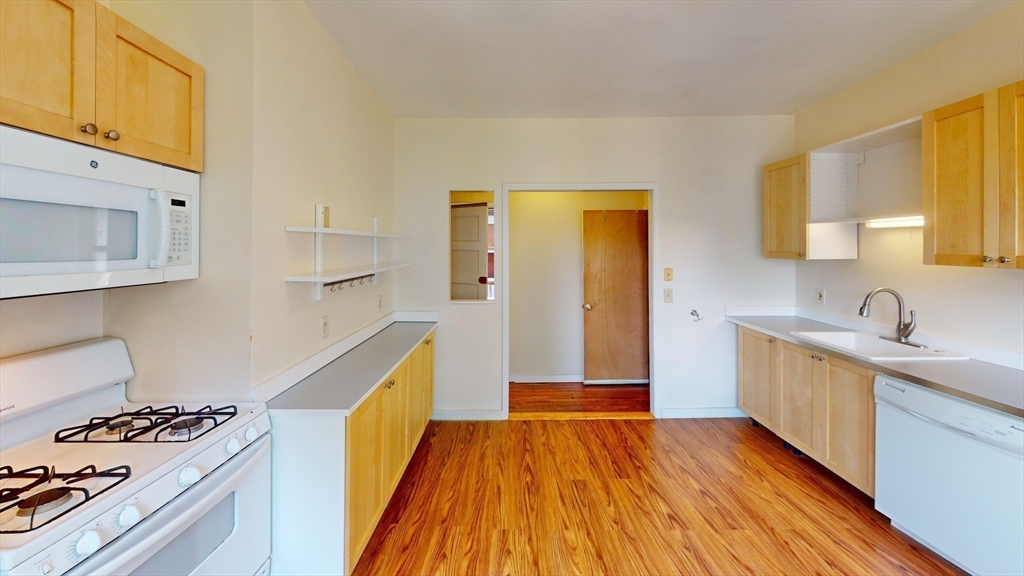 22 Boynton Street Boston, MA 02130 - Photo 27 of 34 a kitchen with a sink and wooden floor