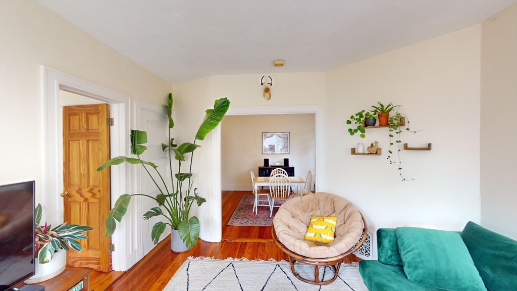 22 Boynton Street Boston, MA 02130 - Photo 3 of 34 a view of a dining room with furniture and a potted plant