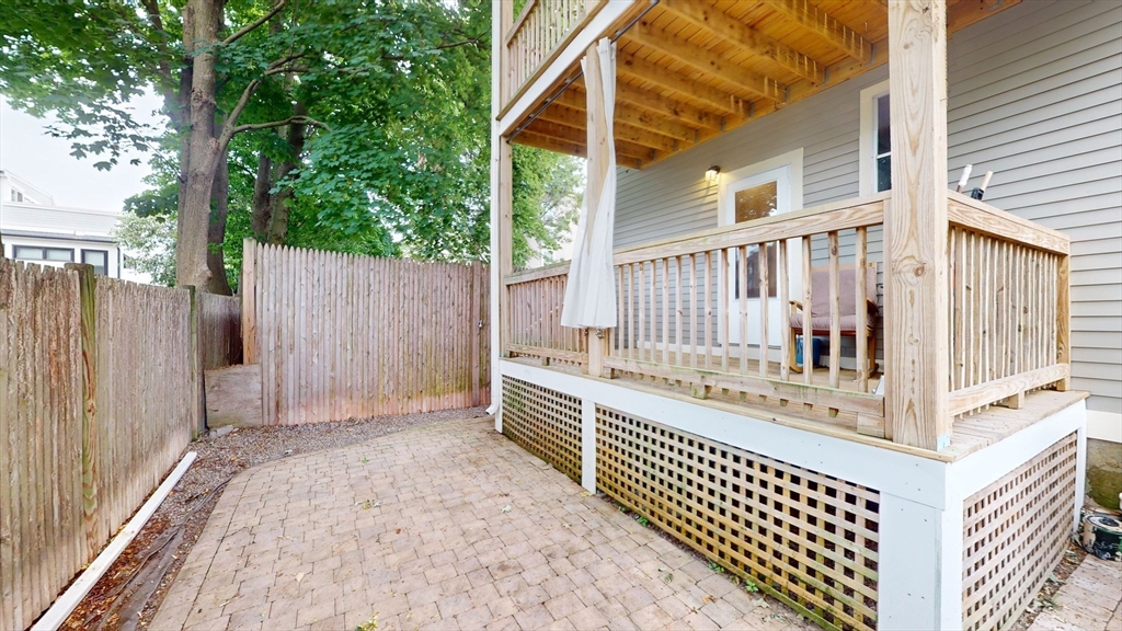 22 Boynton Street Boston, MA 02130 - Photo 31 of 34 a view of balcony with wooden fence and large trees