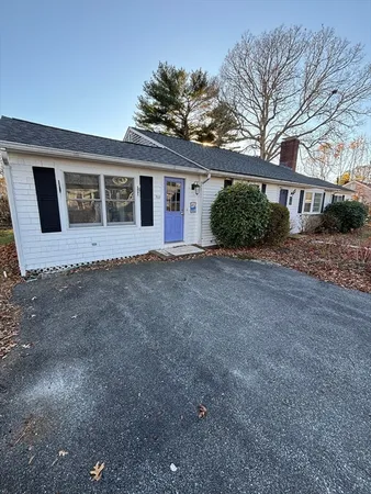 a view of a house with a backyard
