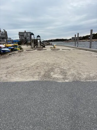 a view of a lake with houses in the back