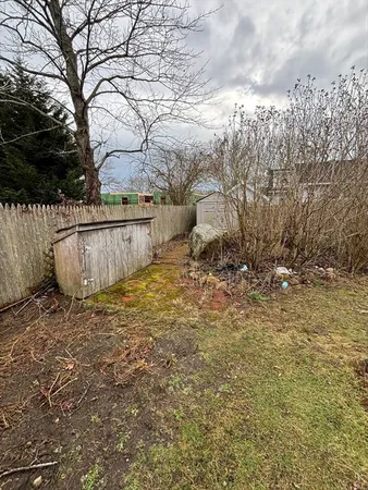 a view of a backyard of the house