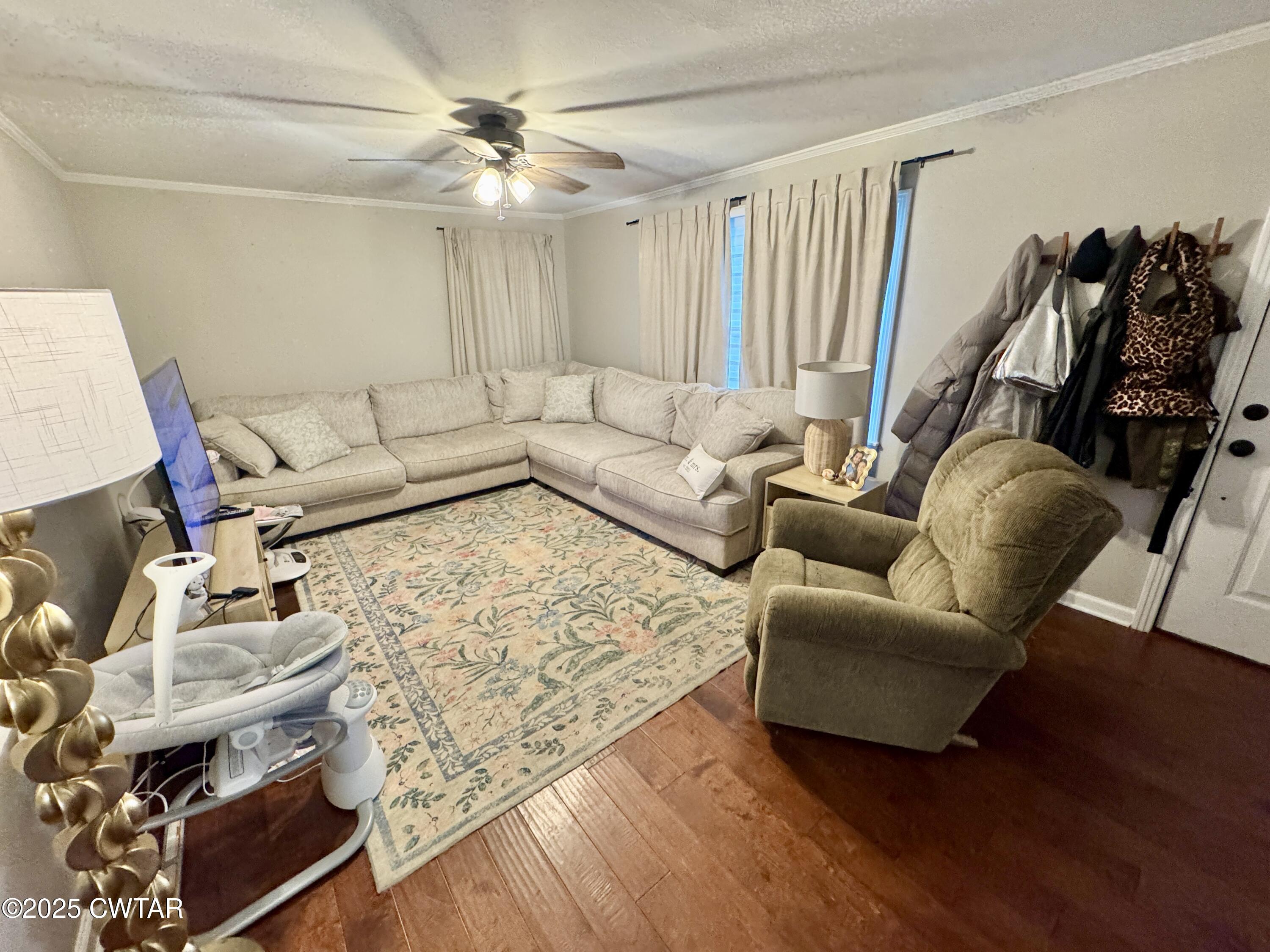 302 Flora Circle Newbern, TN 38059 - Photo 14 of 20 a living room with furniture and a wooden floor
