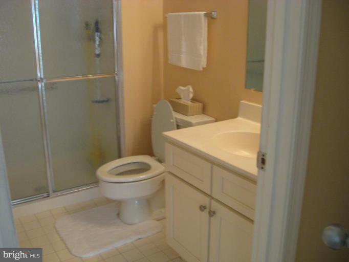 2901 Fallstaff Road, Unit 205 Baltimore, MD 21209 - Photo 8 of 13 a bathroom with a toilet and a shower