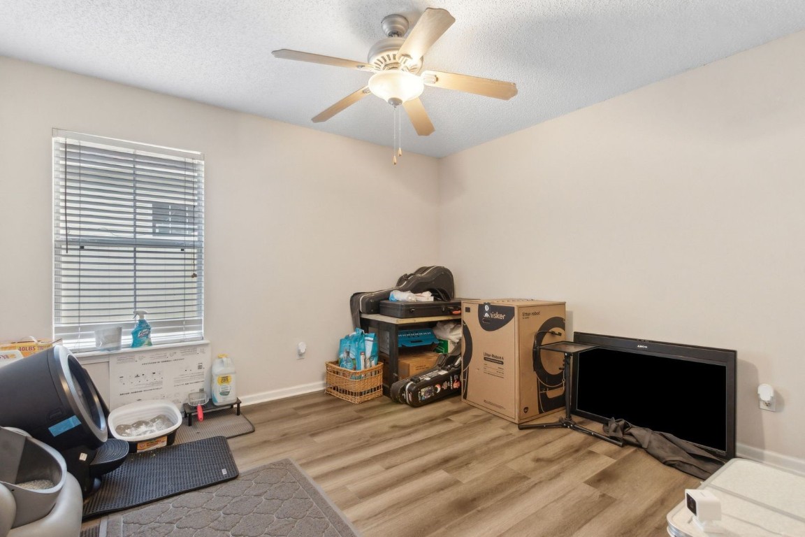 96696 Commodore Point Drive Yulee, FL 32097 - Photo 13 of 21 a bedroom with bed and a chandelier