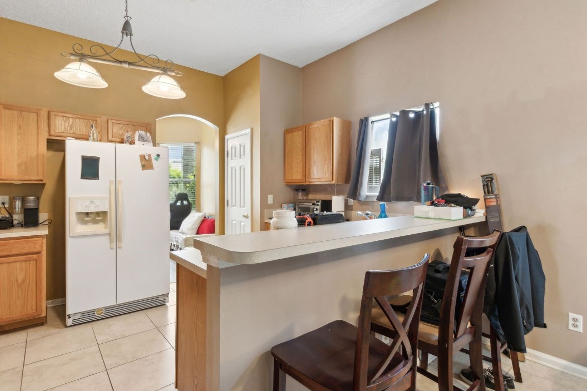 96696 Commodore Point Drive Yulee, FL 32097 - Photo 4 of 21 a kitchen with a sink refrigerator and cabinets