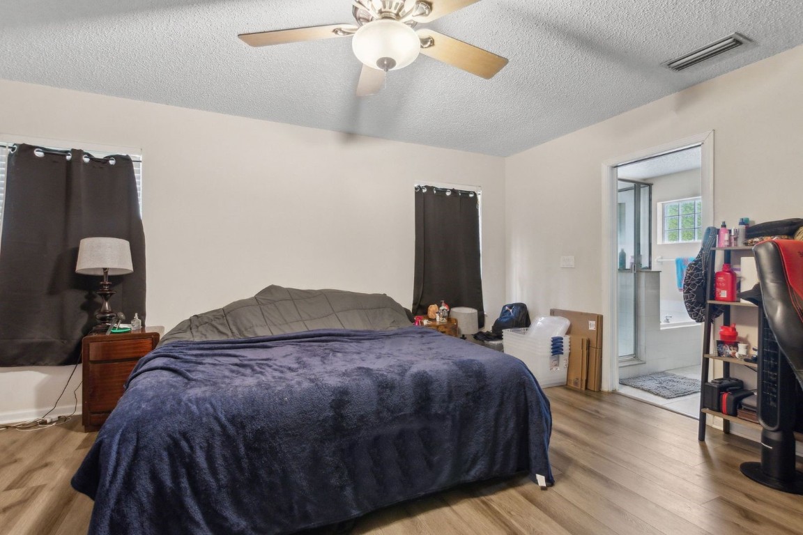 96696 Commodore Point Drive Yulee, FL 32097 - Photo 8 of 21 a bedroom with a bed and a walk in closet