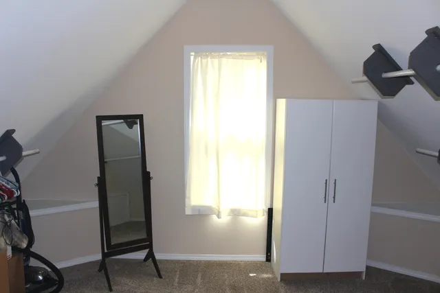 a view of a bathroom with a shower curtain